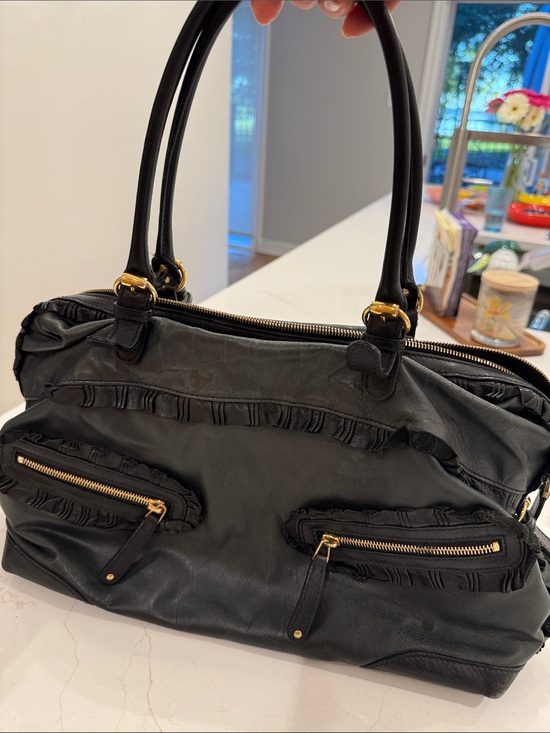 Gucci Handbags - Gucci Black Leather Shoulder Bag with Gold Hardware and Ruffle Trim Accents